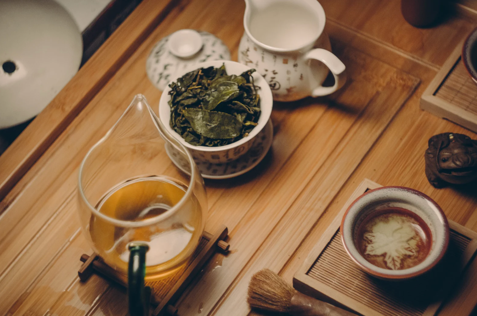 An assortment of different types of tea, including green, black, herbal, and oolong, displayed in a cozy kitchen setting to highlight their health benefits.