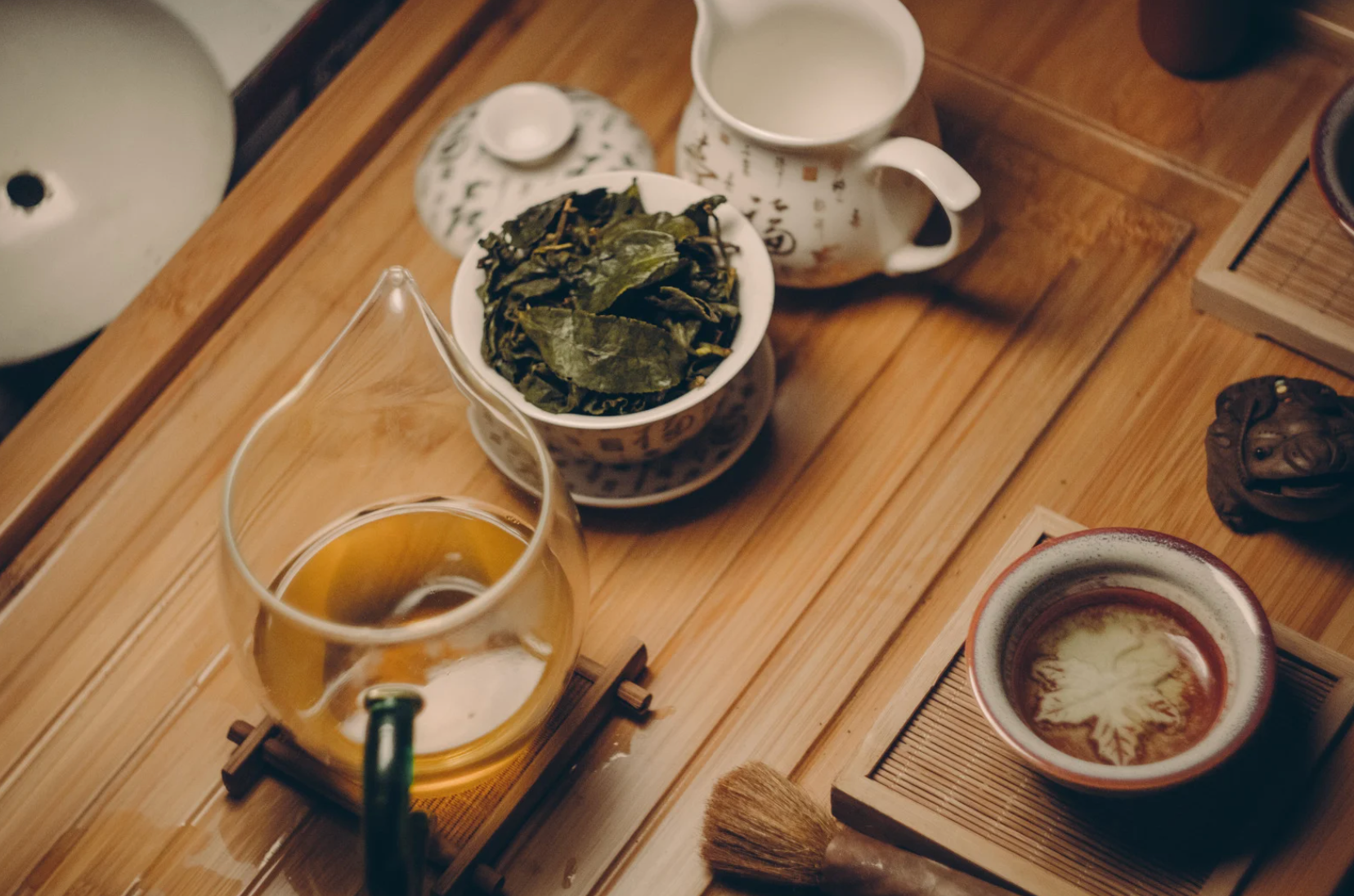  An assortment of different types of tea, including green, black, herbal, and oolong, displayed in a cozy kitchen setting to highlight their health benefits.